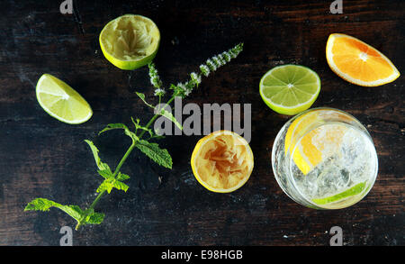 Preparing Lemon Water on Wooden Table for Meal. Source for Anti Oxidants Stock Photo