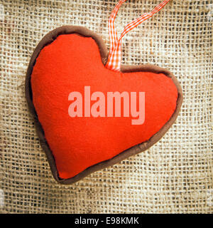 a red Heart on a textile background