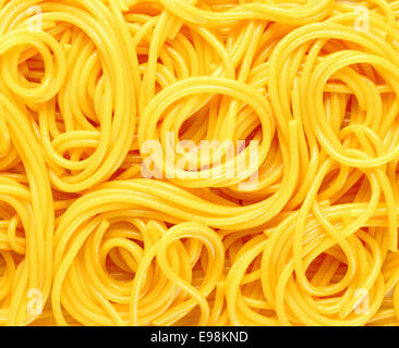 Closeup abstract background of coiled strands of spaghetti pasta Stock Photo