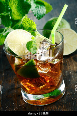 Cuba Libre Drink with lime and Cola,on a wooden plate Stock Photo