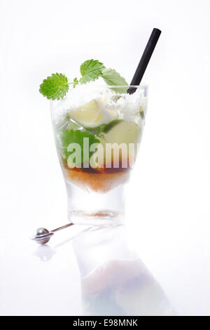 Mojito Cocktail with fresh Limes slices and Cuban Mint isolated on white background for your alcohol beverage concepts Stock Photo