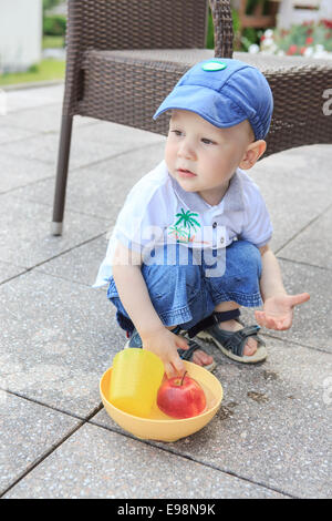 little male child playing in the sandbox Stock Photo