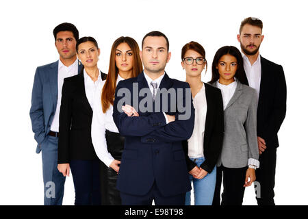 Serious businessman leading his team over white background Stock Photo
