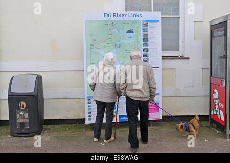Senior couple looking at map, Falmouth, England, UK Stock Photo