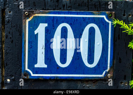 A number 100 sign found in Paris France. Stock Photo
