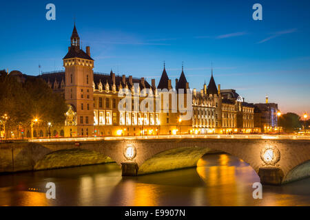 Twilight over the Conciergerie and Pont au Change along the River Seine, Paris France Stock Photo