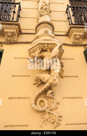 Dragon statue moulding on a wall in Calle Jorge Juan in Valencia, Spain. Stock Photo