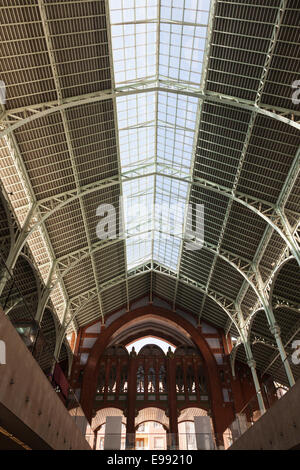 Looking up to the arched metal and glass roof over the Colon market in Valencia, Spain. Stock Photo
