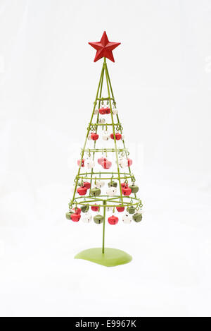 Contemporary metal Christmas tree with bells against a white background Stock Photo