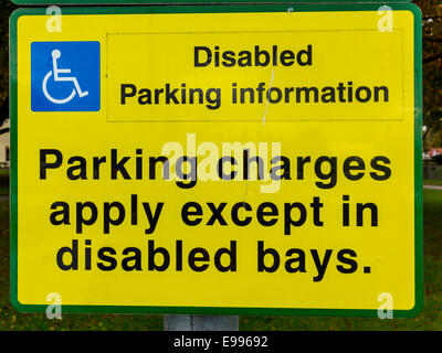 Sign reading Disabled Parking Information Parking Charges Apply except in disabled bays Stock Photo