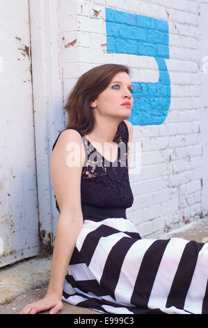 damsel in distress at warehouse downtown Stock Photo