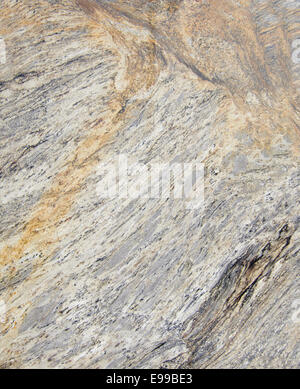 A full slab of cut and polished Granite makes a background of textures, patterns and colors. Stock Photo