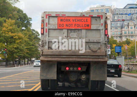 Do Not Follow sign on back of dump truck - USA Stock Photo