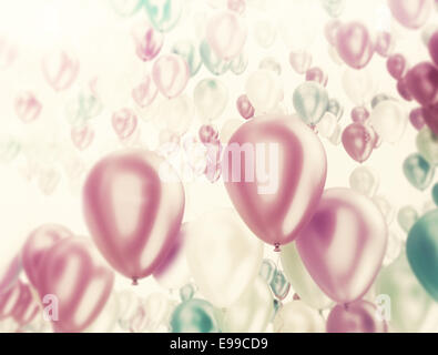 Group of multi color party balloons on white background Stock Photo - Alamy