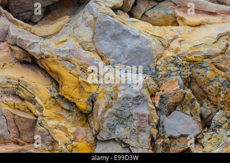 Colourful selection of deposits on a limestone cliff in the Frioul archipelago, Marseille. Stock Photo