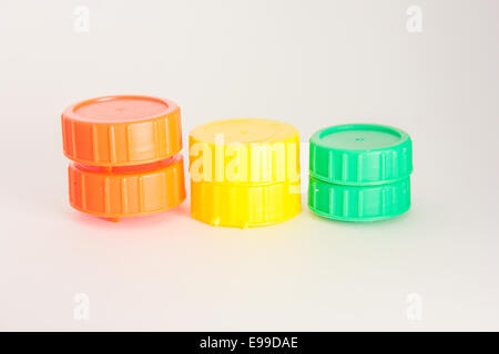 Stock Photo - Colorful plastic caps isolated in white Stock Photo
