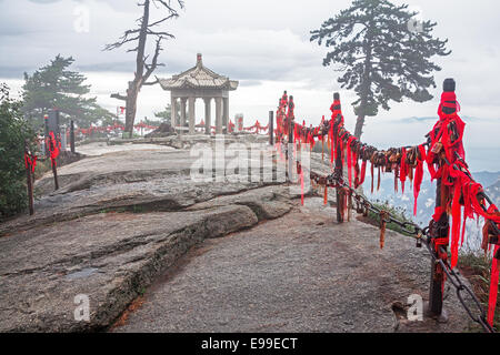 Foggy fabulous atmosphere with chinese style gazebo in Huashan national park, China. Stock Photo