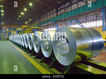 packed coils of steel sheet inside of plant Stock Photo