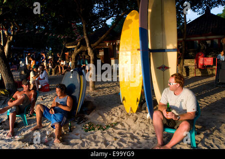 Beach of Kuta at sunset. Surfing lessons. Bali. Kuta is a coastal town in the south of the island of Lombok in Indonesia. The sc Stock Photo