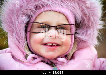 This is Closeup of funny baby in glasses Stock Photo
