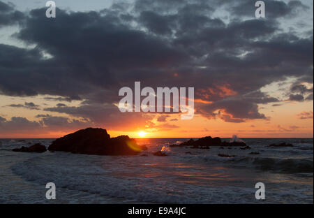 The Wales Coastal Path in North Wales. Picturesque view of sunset at Church Bay beach on the west coast of Anglesey. Stock Photo