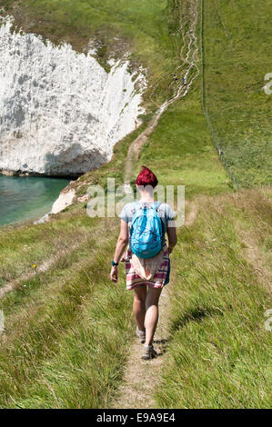 Young female hiker walks the Jurassic Coastline, Dorset, Great Britain Stock Photo