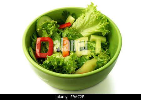 Green plate with word diet composed of slices of different vegetables on salad Stock Photo
