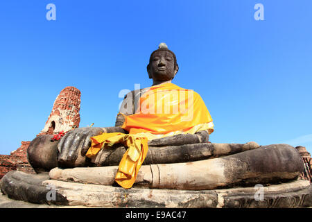 black buddha statue over blue sky Stock Photo