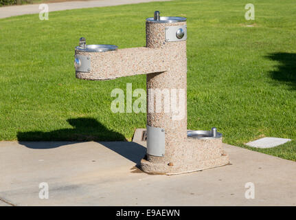 Concrete drinking fountain in park Stock Photo