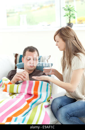 Caucasian woman taking care of her husband Stock Photo