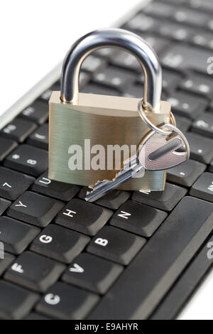 Padlock standing on a keyboard Stock Photo