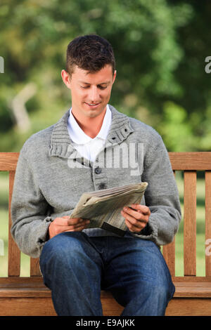 Man making his crossword Stock Photo Alamy