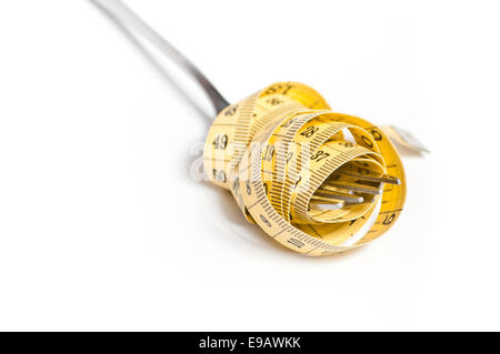 measuring tape on a fork concept Stock Photo
