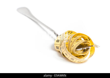 measuring tape on a fork concept Stock Photo