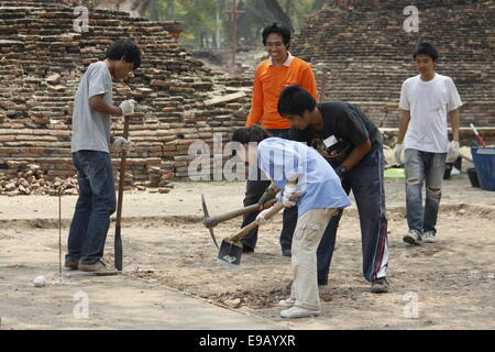 Archaeological dig conducted by young Thai on the site of Ayutthaya is a World Heritage Site by UNESCO. Stock Photo