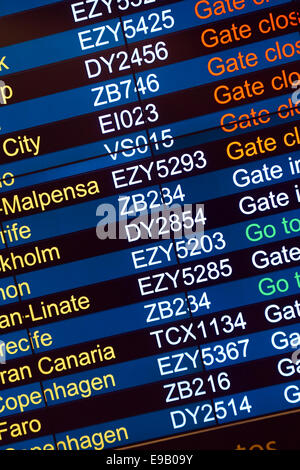 Airport flight departure board. Stock Photo