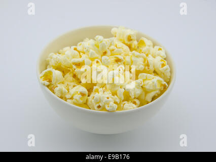 popcorn in white  bowl on white background Stock Photo