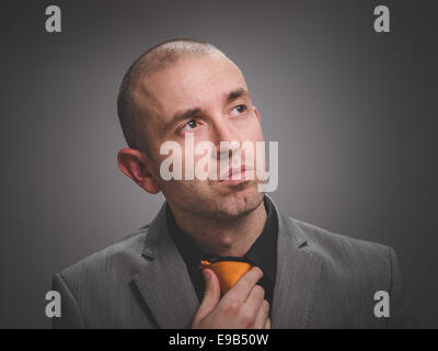 Interesting businessman portrait isolated on dark background Stock Photo