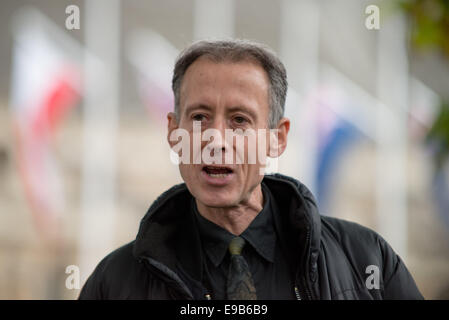 Human rights campaigner Peter Tatchell speaks to activists protesting in Westminster. Stock Photo