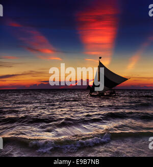 Tropical sunset with sailboat, Boracay, Philippines Stock Photo