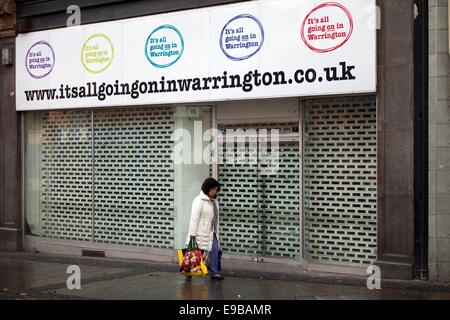 'It's all happening in Warrington'  Closed and shuttered shops in Bridge Street, Warrington, UK Stock Photo