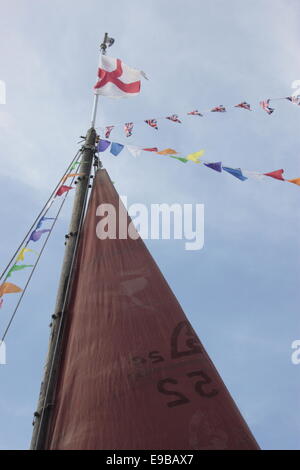 Detail of red sails in bright sun with shadow on Humber Keel barge at Beverley Beck, East Yorkshire. Flags, Union Jacks English Stock Photo
