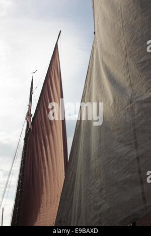 Red and white sails in bright sun with shadow on Humber Keel barge at Beverley Beck, East Yorkshire. Stock Photo