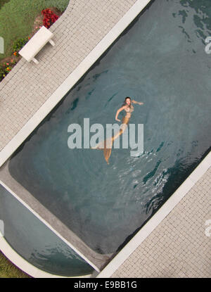 Aerial photo of a mermaid swimming in a pool in Virginia Beach, Virginia Stock Photo