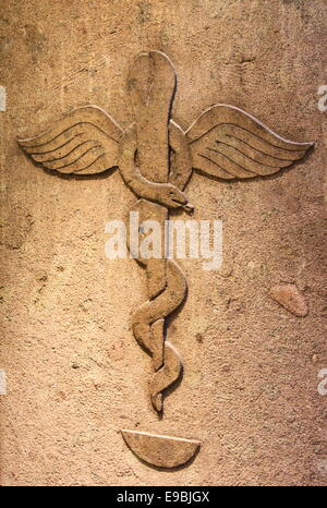 Ancient pharmacy with the symbol of medical caduceus Stock Photo