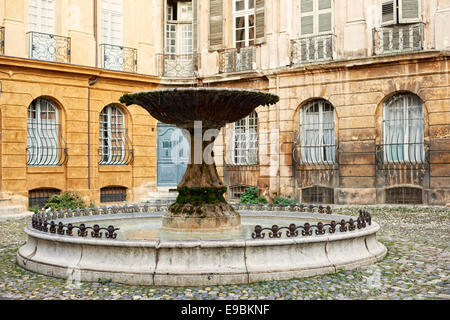 Ancient fountain on a square in Aix-en-Provence, South France. Stock Photo