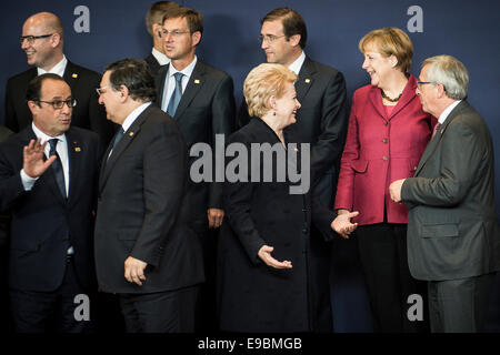 Brussels, Belgium. 23rd Oct, 2014. EU leaders French President Francois Holland, Italian Prime Minister Matteo Renzi, Lithuanian President Dalia Grybauskaite, German Federal Chancellor Angela Merkel, European Commission President Jean-Claude Juncker as they prepare to pose during the group photocall at the EU Summit at the EU Council headquaters in Brussels, Belgium on 23.10.2014 The two-day summit of the European Council in Brussels will focus on an ambitious package of climate change targets for 2030 but also tackle the Ebola crisis, economic stagnation, concern over Ukraine and tension in C Stock Photo