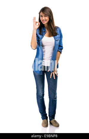 Beautiful woman making a Okay signal with her hand, isolated over white background Stock Photo