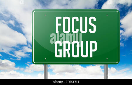 Focus Group on Green Highway Signpost. Stock Photo