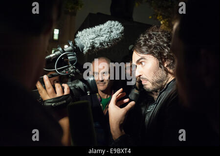 Parliament Square, London, UK. 23rd October 2014. Russell Brand visits the Occupy demonstration in Parliament Square, London, to give a short speech and to supply sleeping bags to protesters intending on stopping the night opposite Parliament. Credit:  Lee Thomas/Alamy Live News Stock Photo